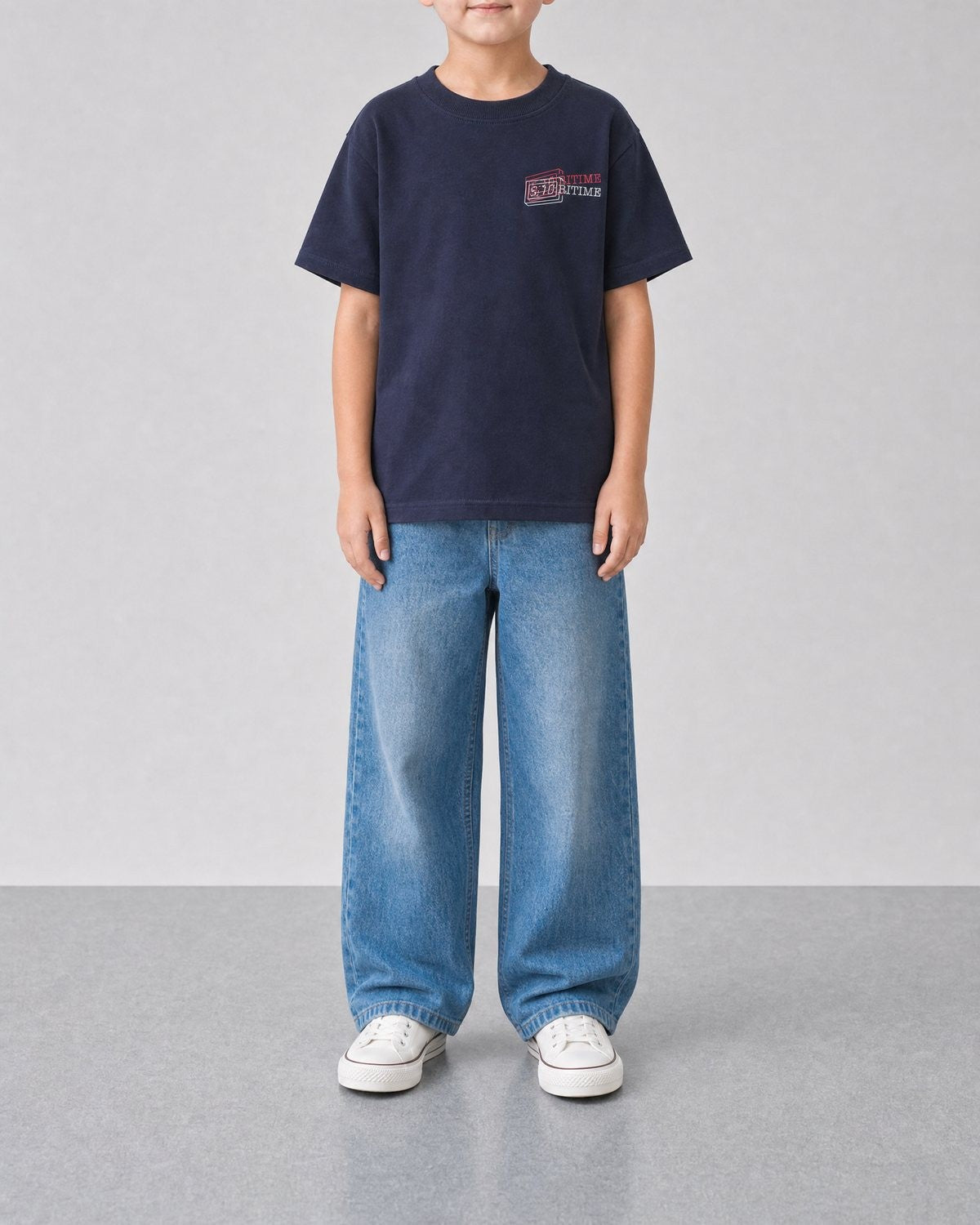 STORITIME® READ More Books Tee in Midnight Paradise, front on-body view with relaxed blue denim.