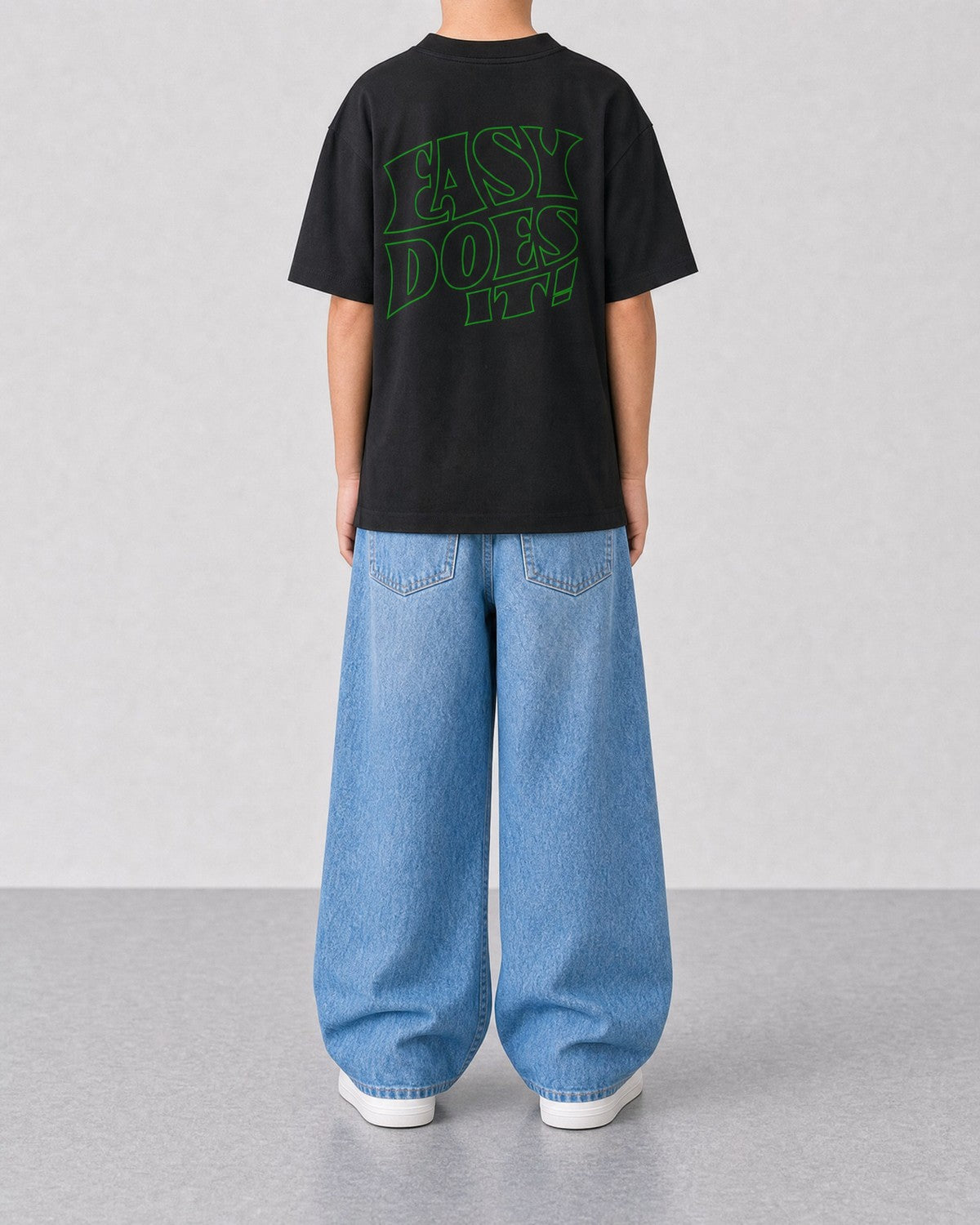 STORITIME® EASY Does It Tee in Black Gecko, back on-body view with relaxed blue denim.